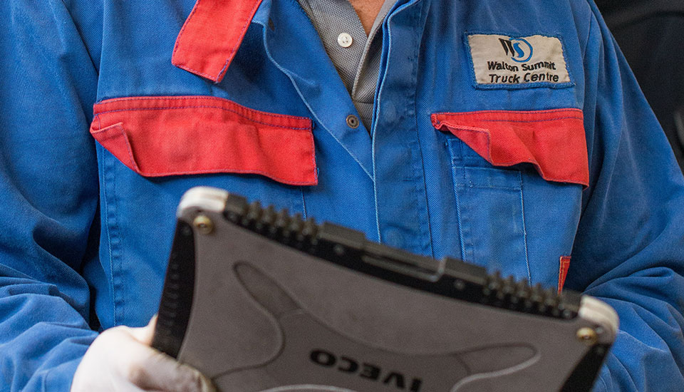 Walton Service Mechanic with a digital reader